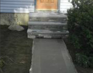 concrete walkway and stone stairway residential