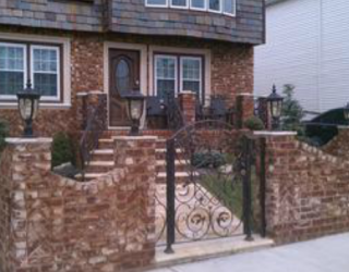 decorative fencing and walkway installed by pavers