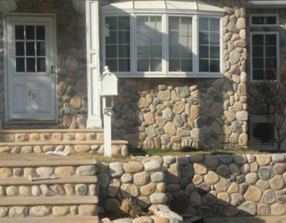 cultured stone installed by pavers on house