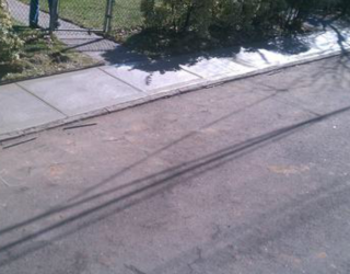 Cement sidewalk poured cement by pavers